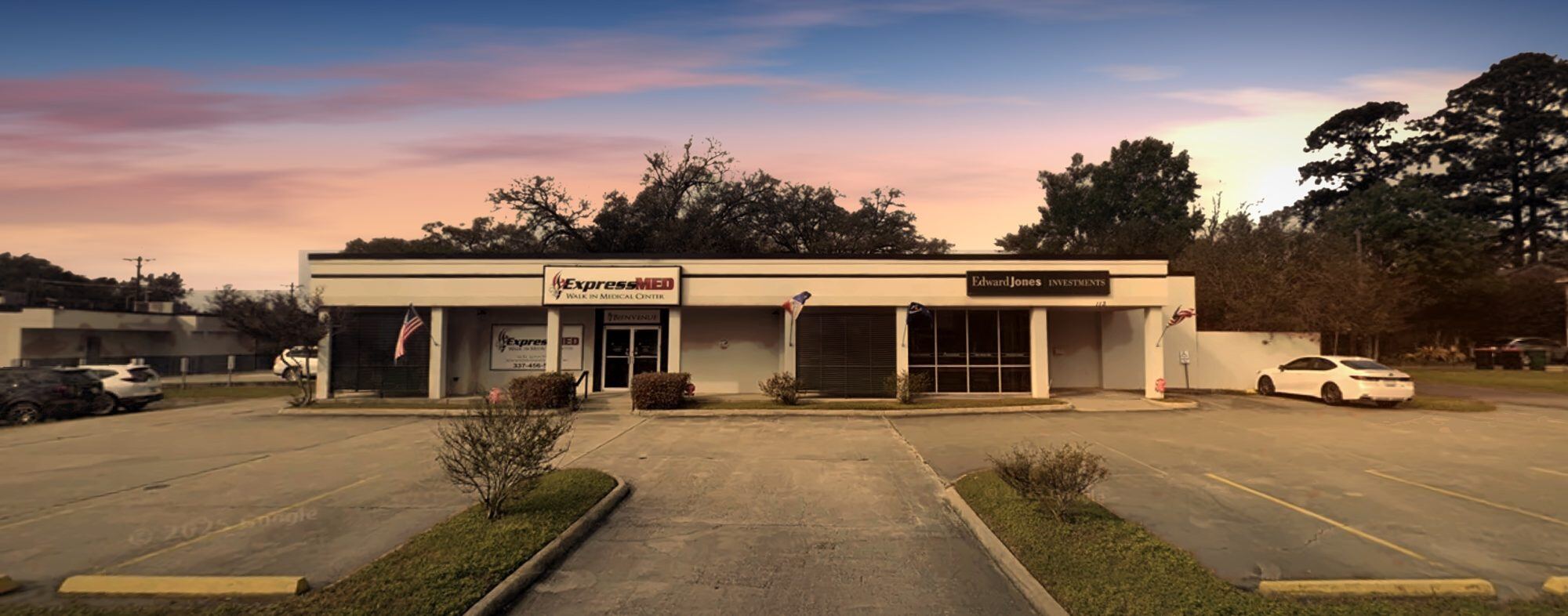 The ExpressMED Walk In Medical Center building on St. Louis Street in Lafayette at sunset
