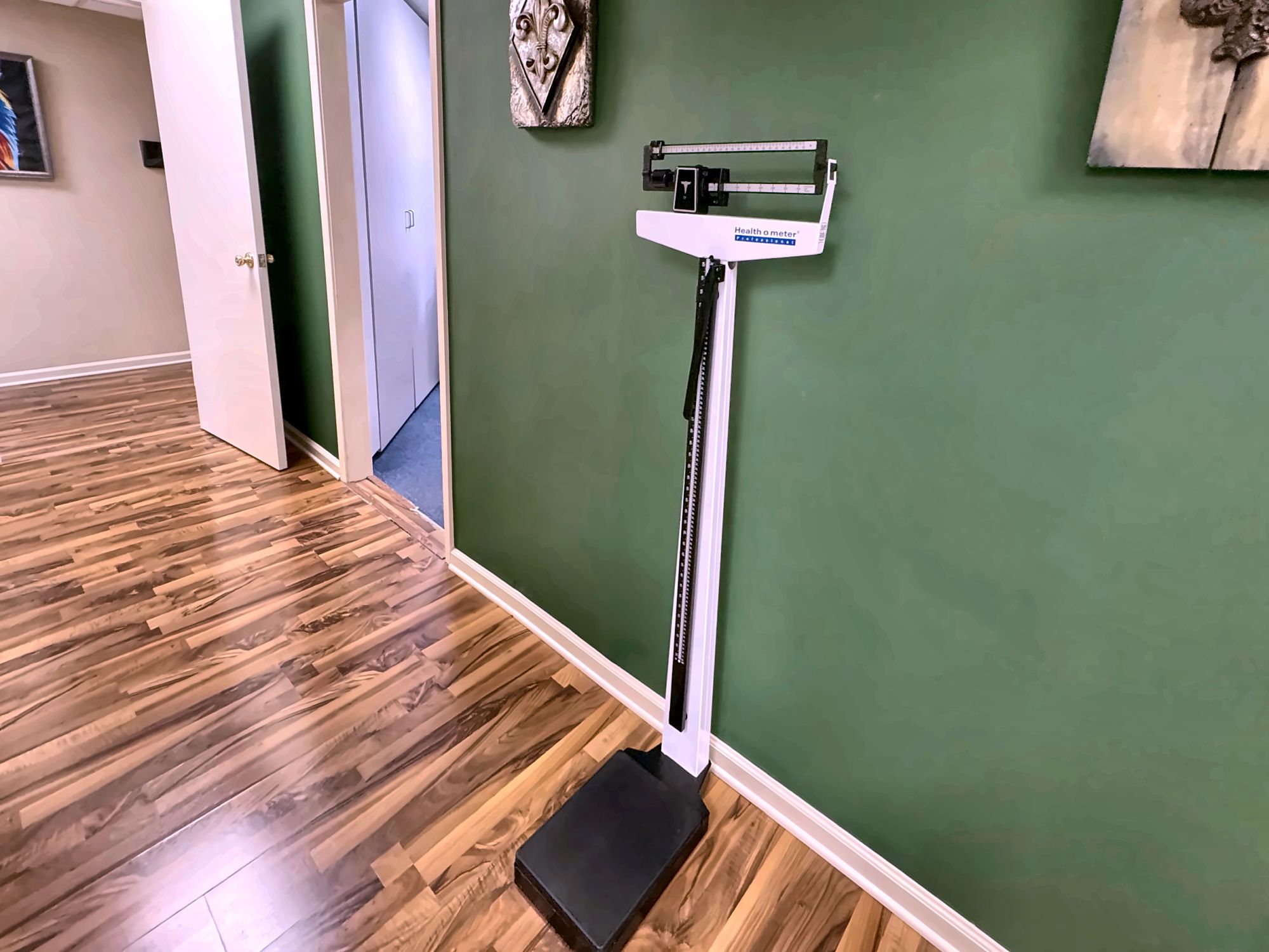A medical scale in the ExpressMED hallway, used for work and sports physicals
